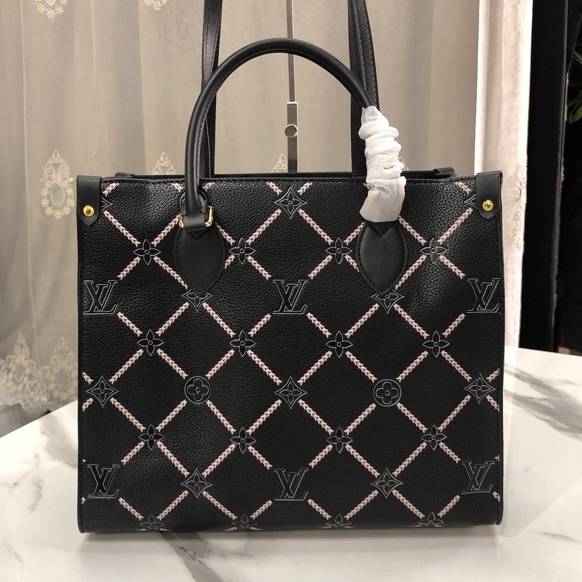 Louis Vuitton Monogram Empreinte Broderies OnTheGo MM tote bag
