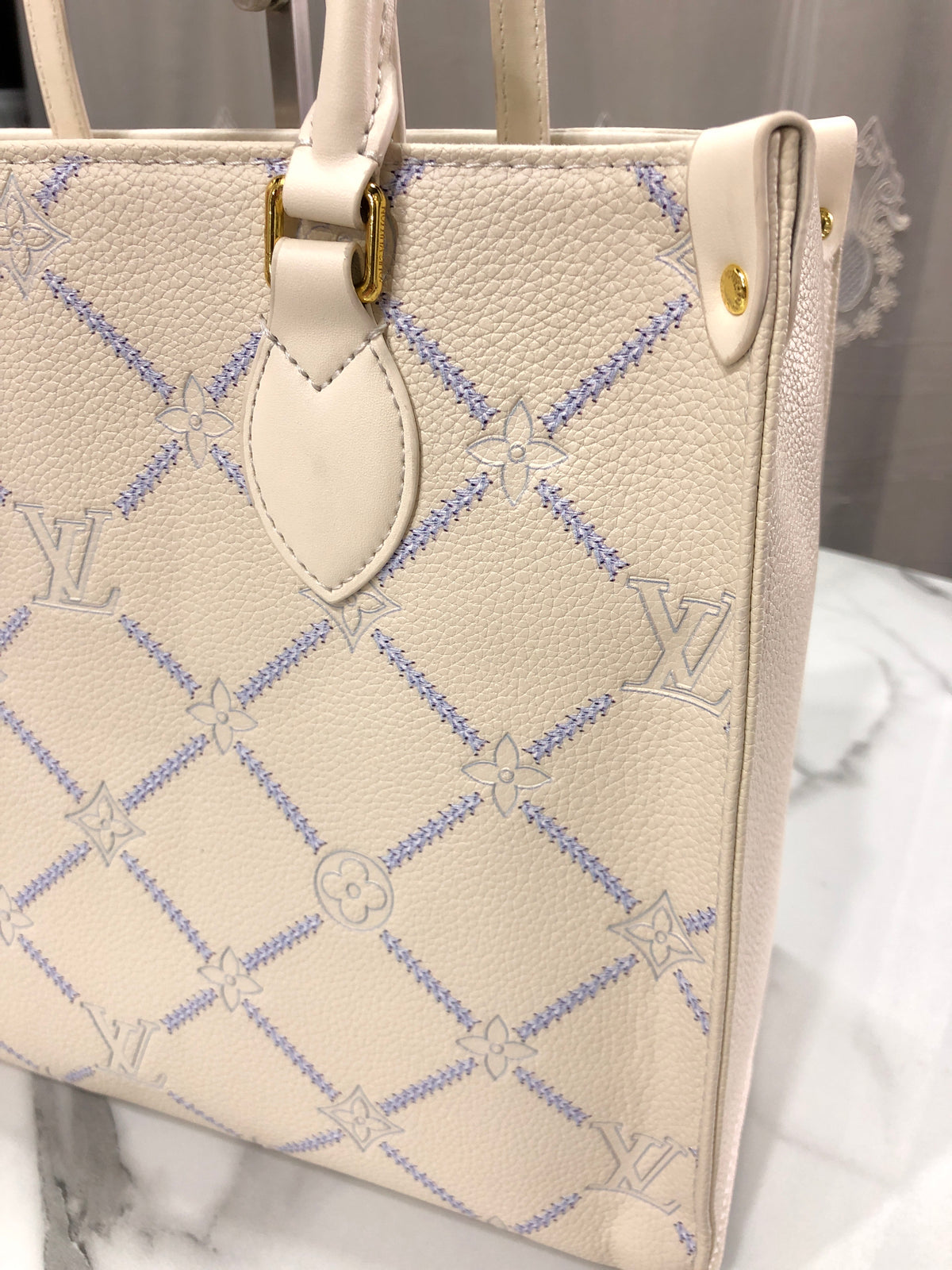 Louis Vuitton Monogram Empreinte Broderies OnTheGo MM tote bag