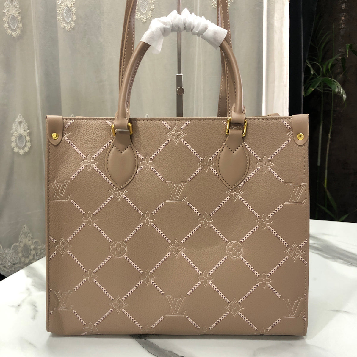 Louis Vuitton Monogram Empreinte Broderies OnTheGo MM tote bag