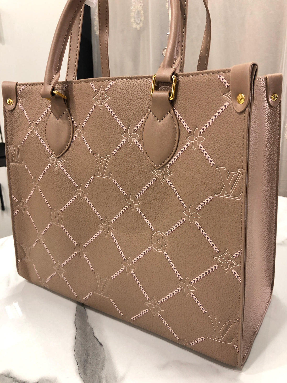 Louis Vuitton Monogram Empreinte Broderies OnTheGo MM tote bag