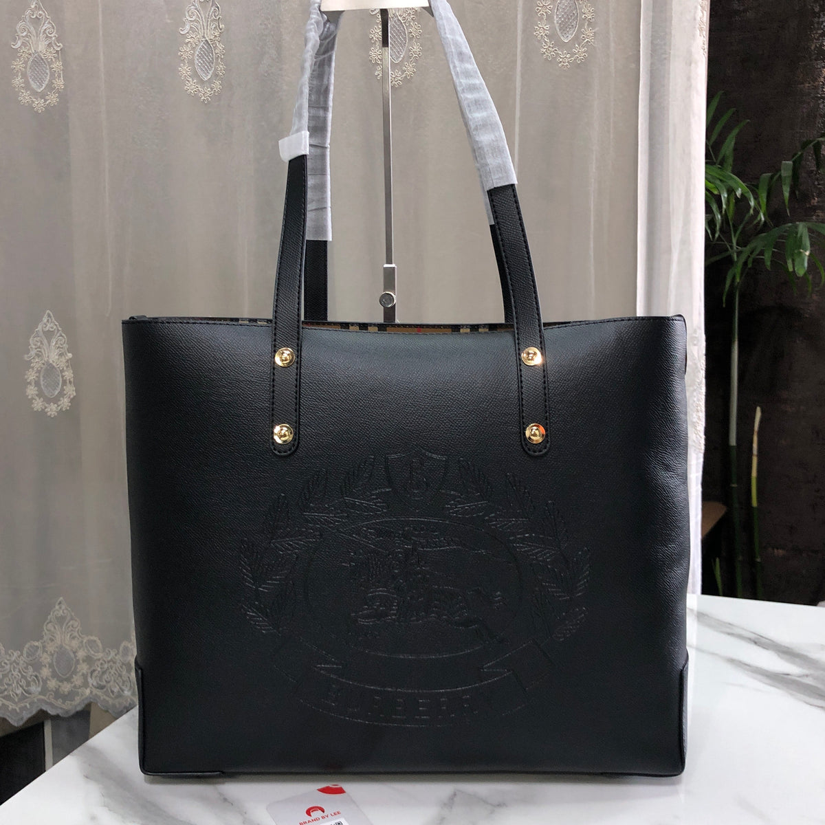 Burberry Embossed Crest Leather Tote Bag