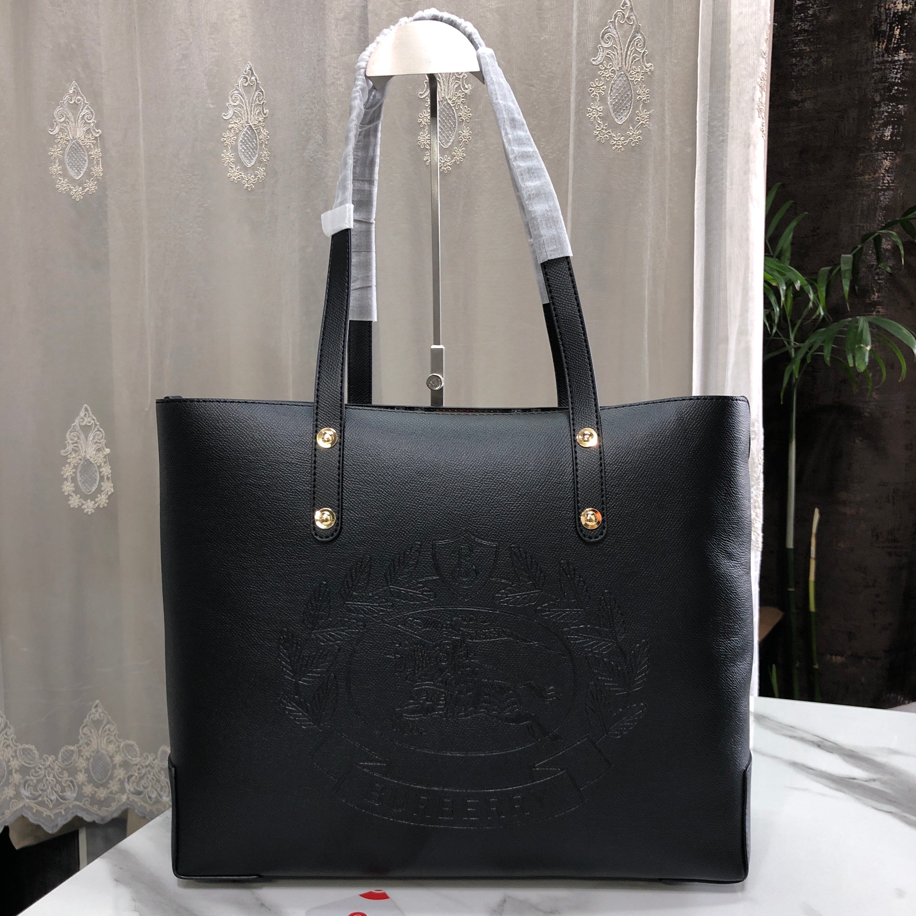 Burberry Embossed Crest Leather Tote Bag