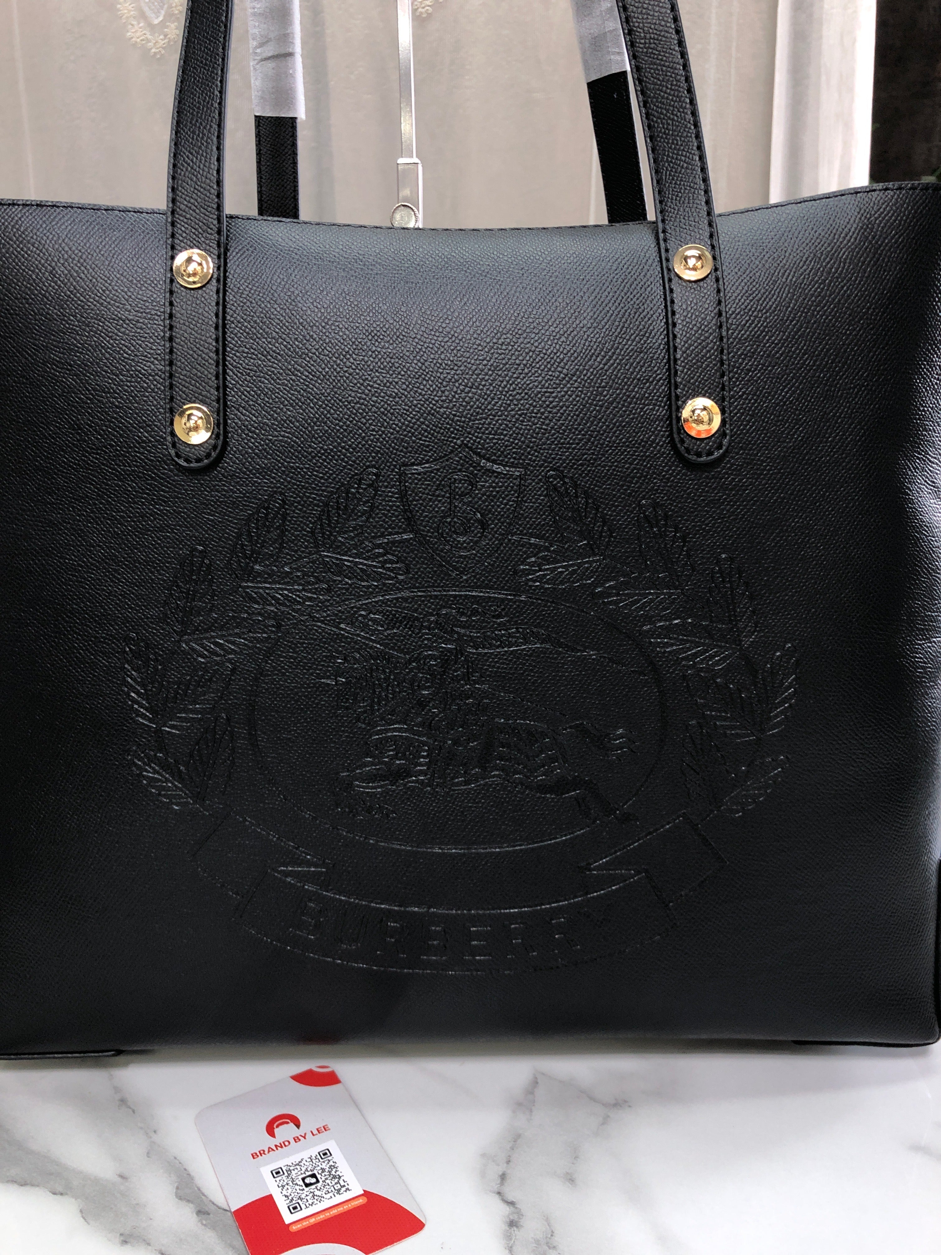 Burberry Embossed Crest Leather Tote Bag
