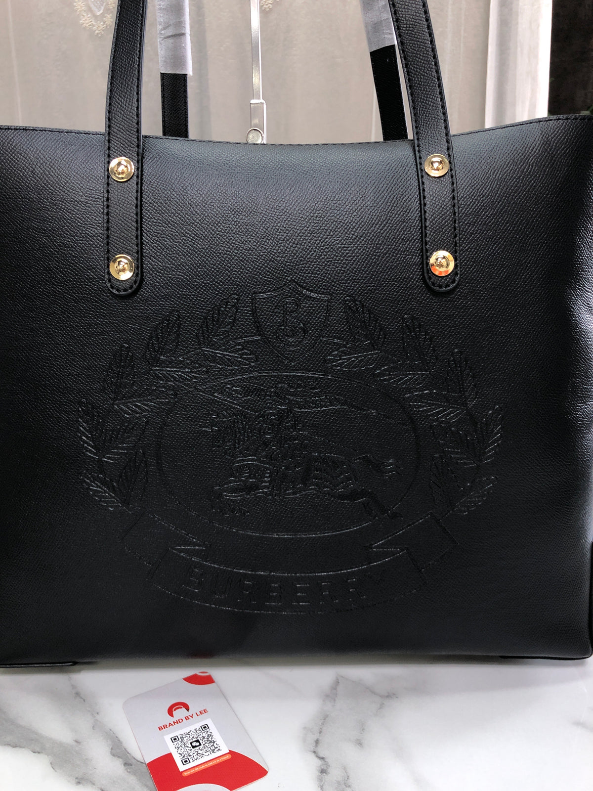 Burberry Embossed Crest Leather Tote Bag