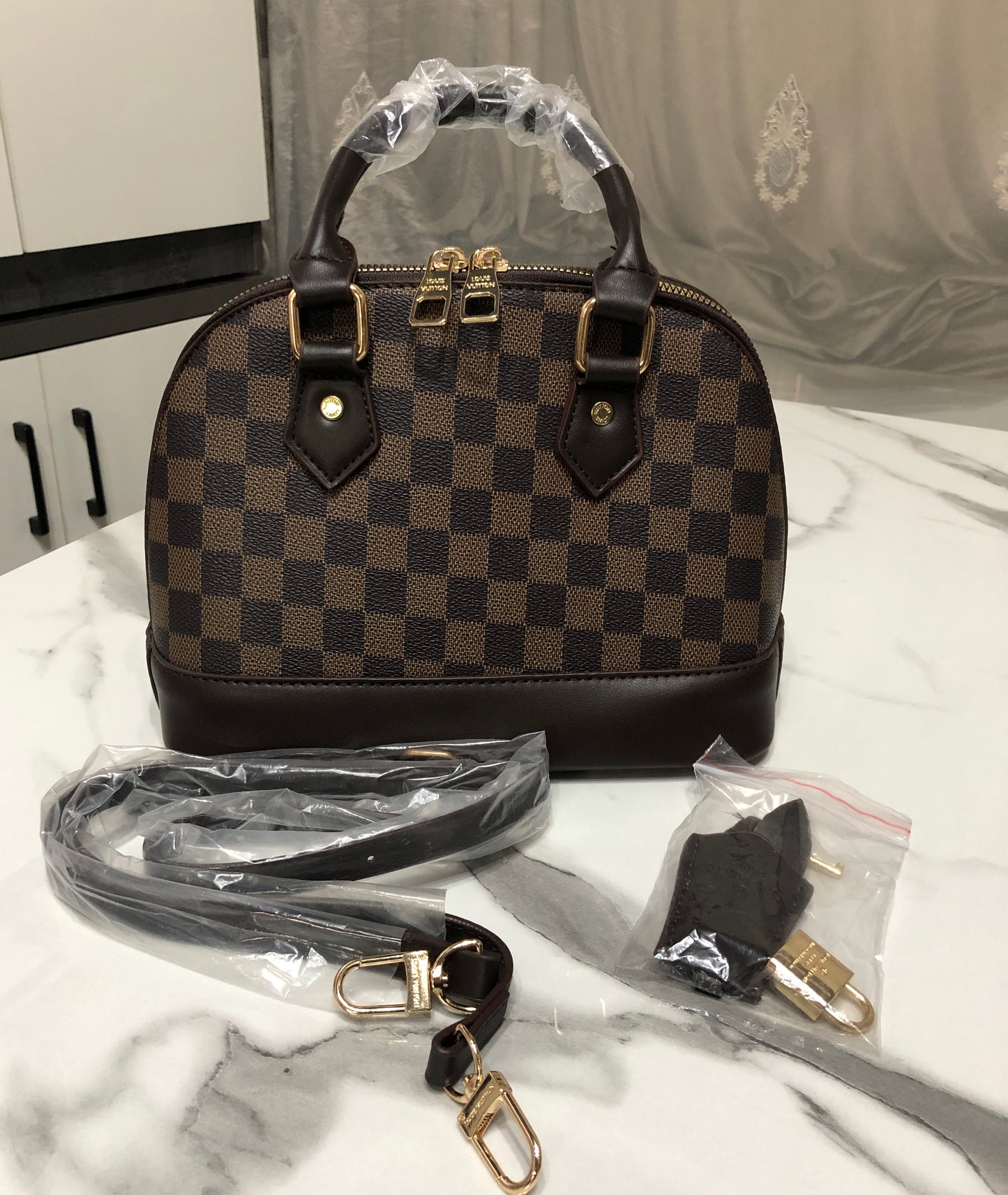 Louis Vuitton Alma Handbag