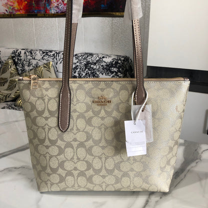 Coach Fiona Zip Tote Bag in Signature Canvas.
