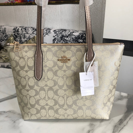 Coach Fiona Zip Tote Bag in Signature Canvas.