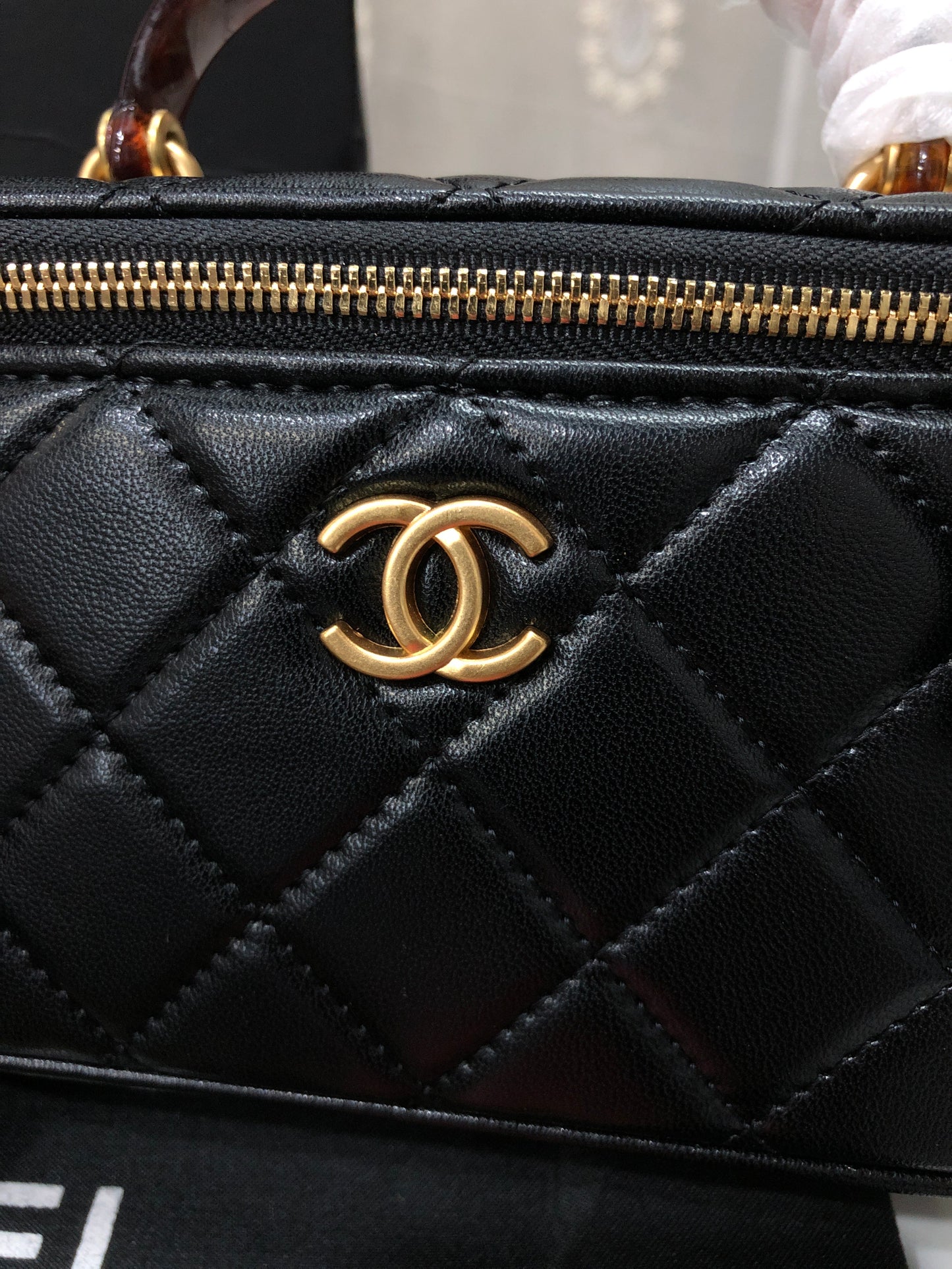 Chanel Quilted Lambskin Vanity Case with a top handle