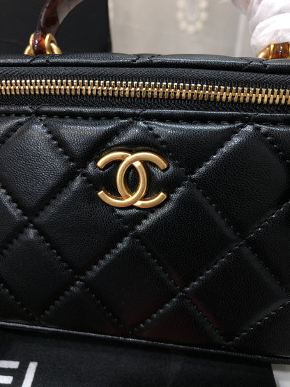 Chanel Quilted Lambskin Vanity Case with a top handle