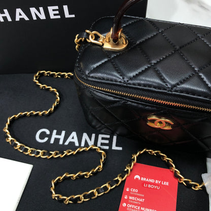 Chanel Quilted Lambskin Vanity Case with a top handle