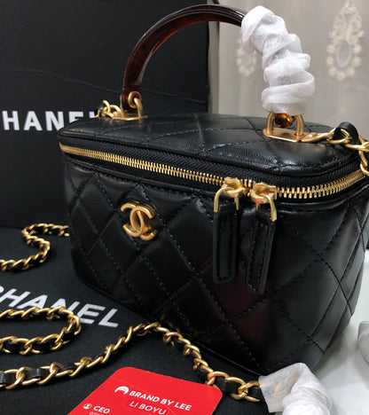 Chanel Quilted Lambskin Vanity Case with a top handle