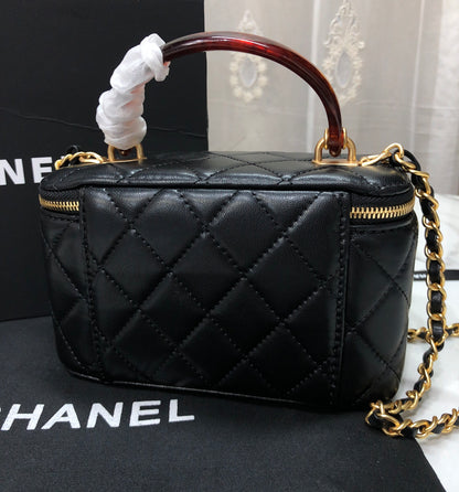 Chanel Quilted Lambskin Vanity Case with a top handle