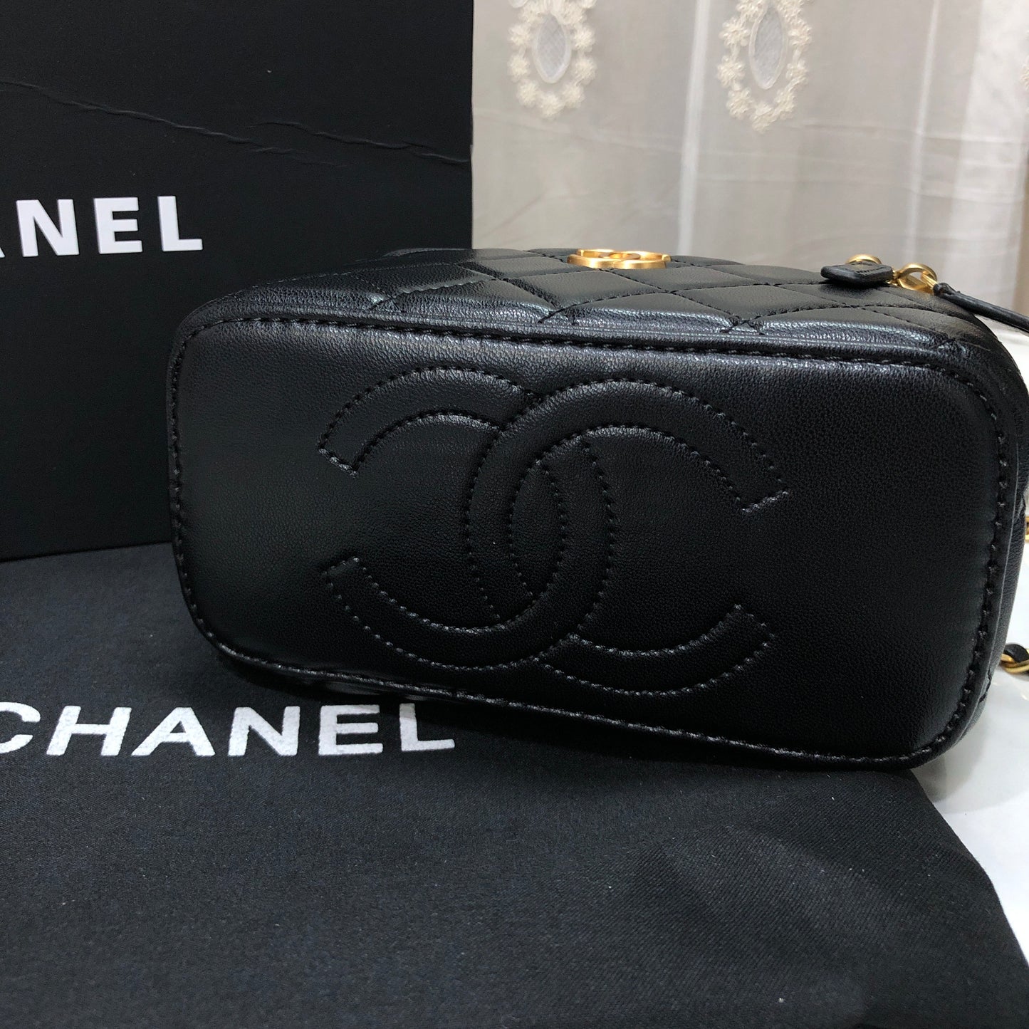 Chanel Quilted Lambskin Vanity Case with a top handle