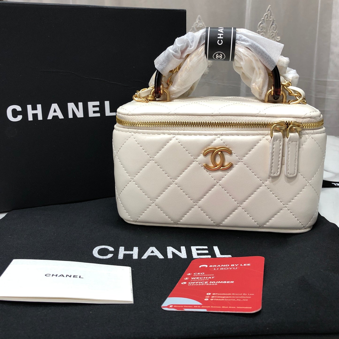 Chanel Quilted Lambskin Vanity Case with a top handle