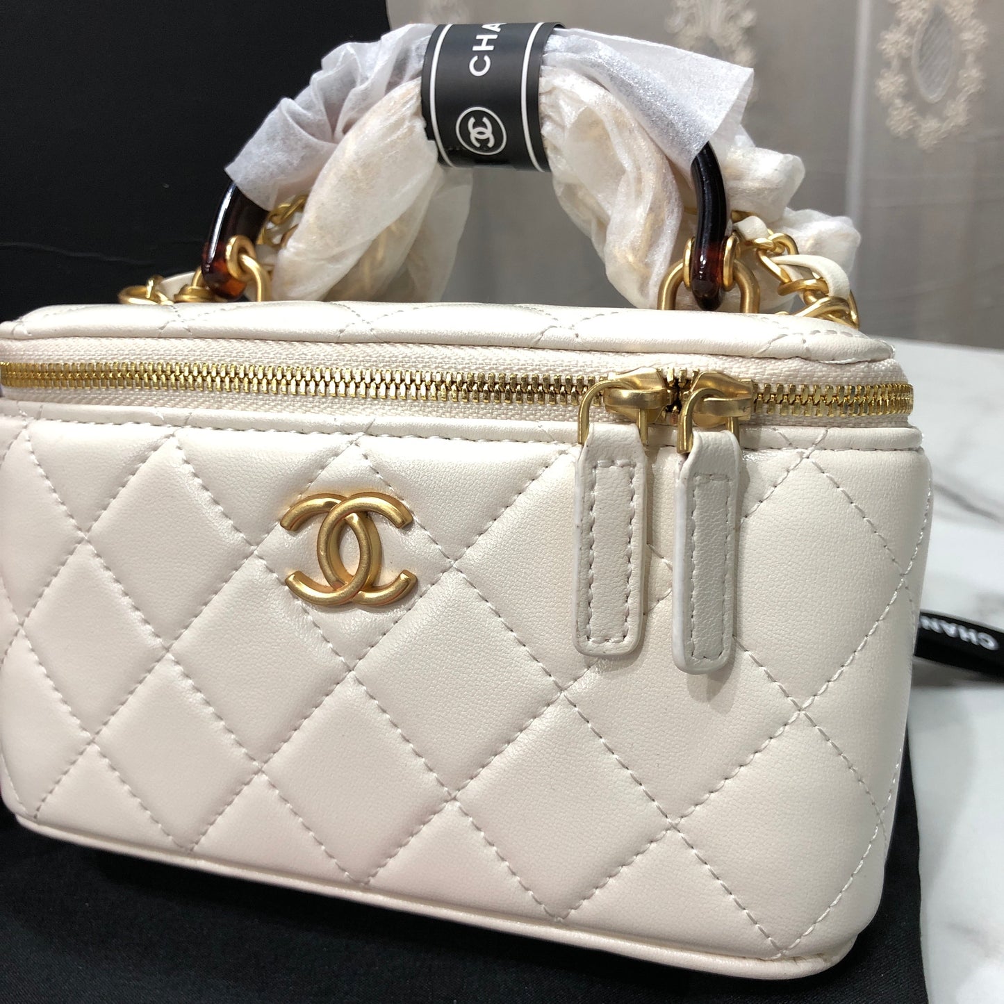 Chanel Quilted Lambskin Vanity Case with a top handle