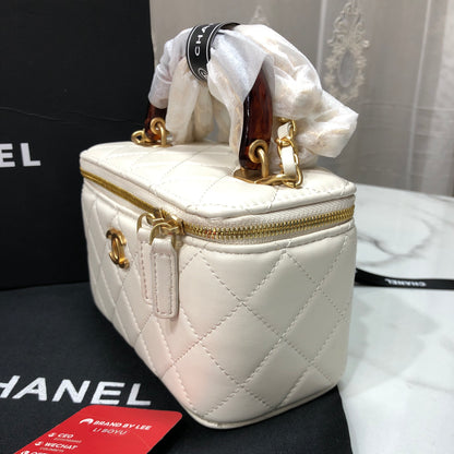 Chanel Quilted Lambskin Vanity Case with a top handle