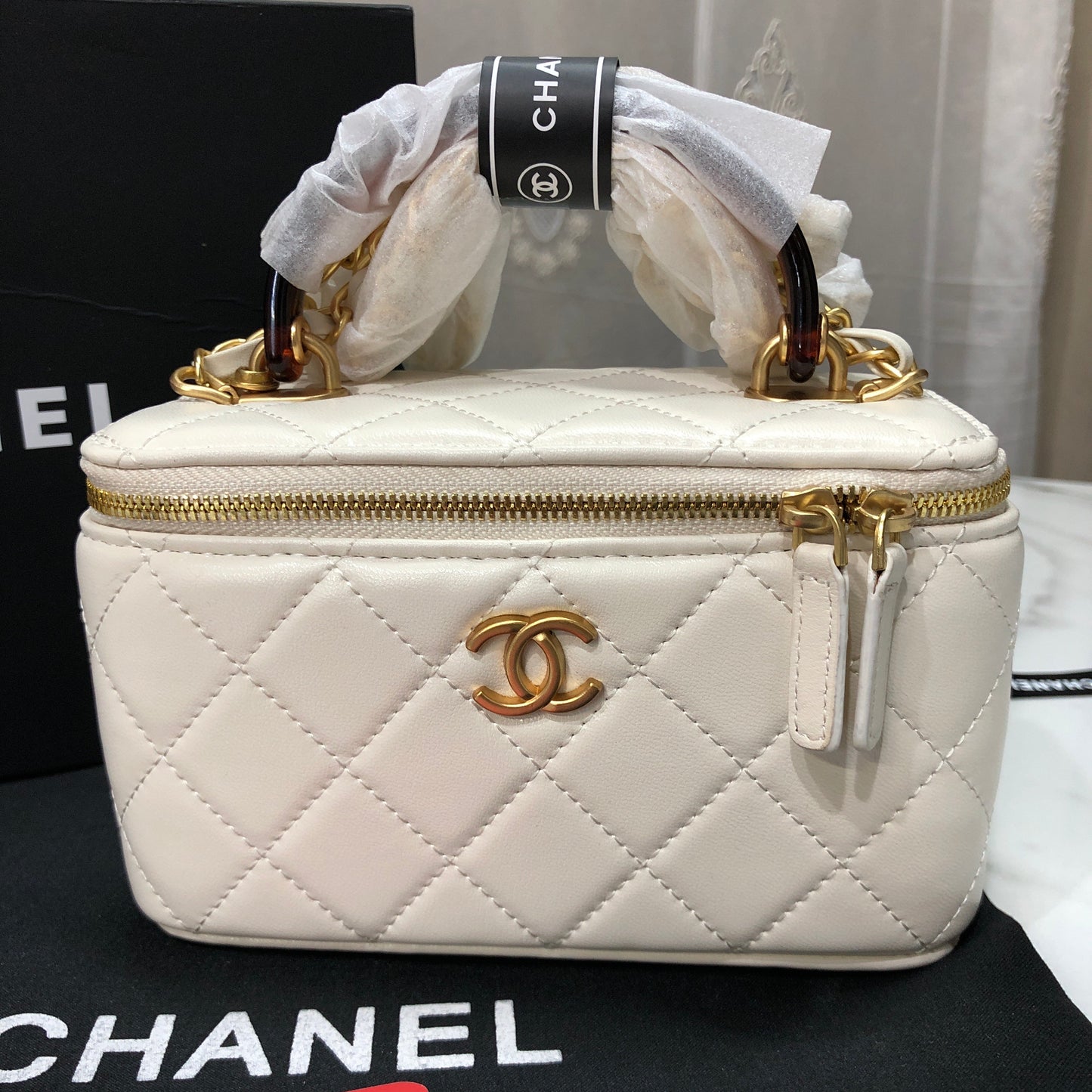 Chanel Quilted Lambskin Vanity Case with a top handle
