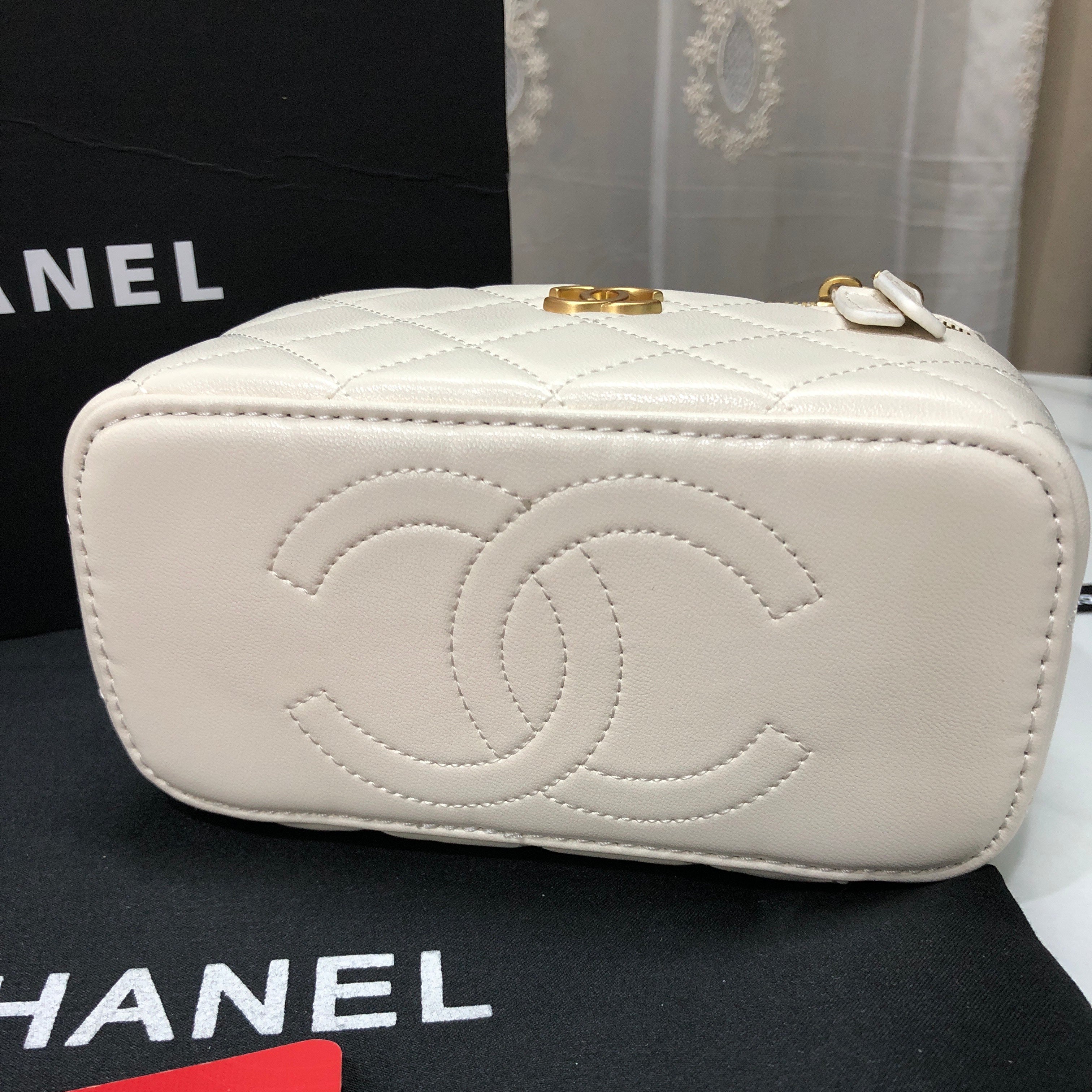 Chanel Quilted Lambskin Vanity Case with a top handle