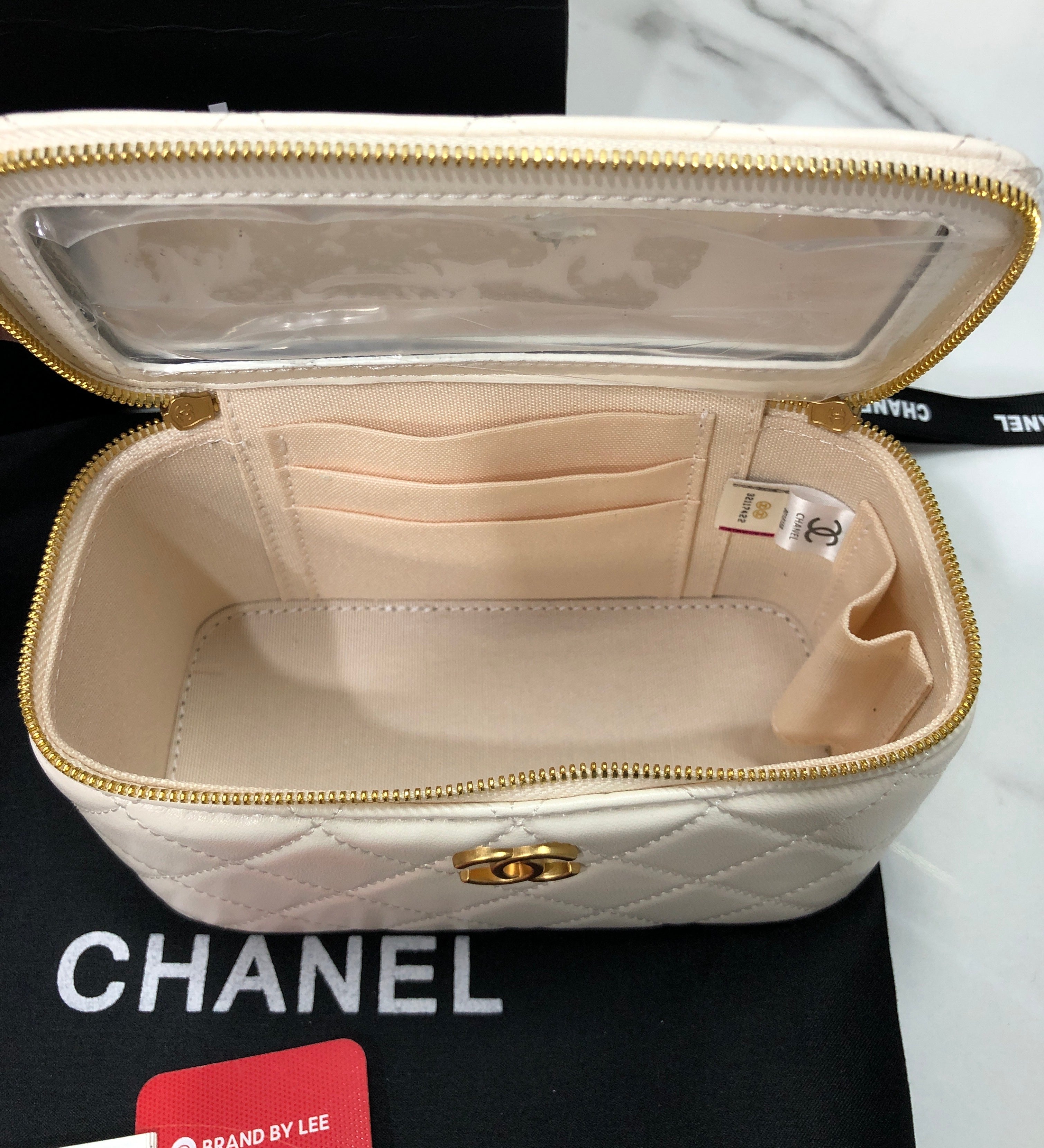 Chanel Quilted Lambskin Vanity Case with a top handle