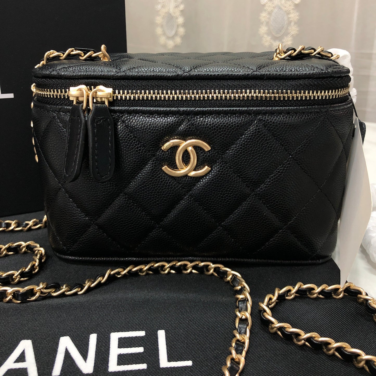 Chanel black caviar quilted vanity case