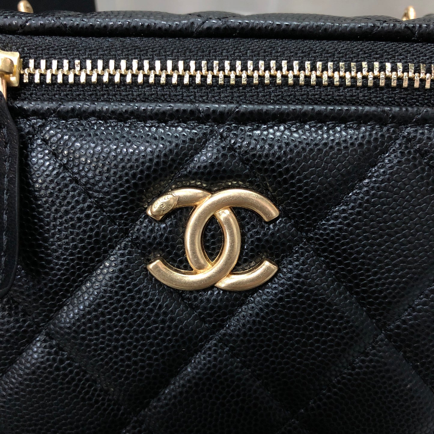 Chanel black caviar quilted vanity case