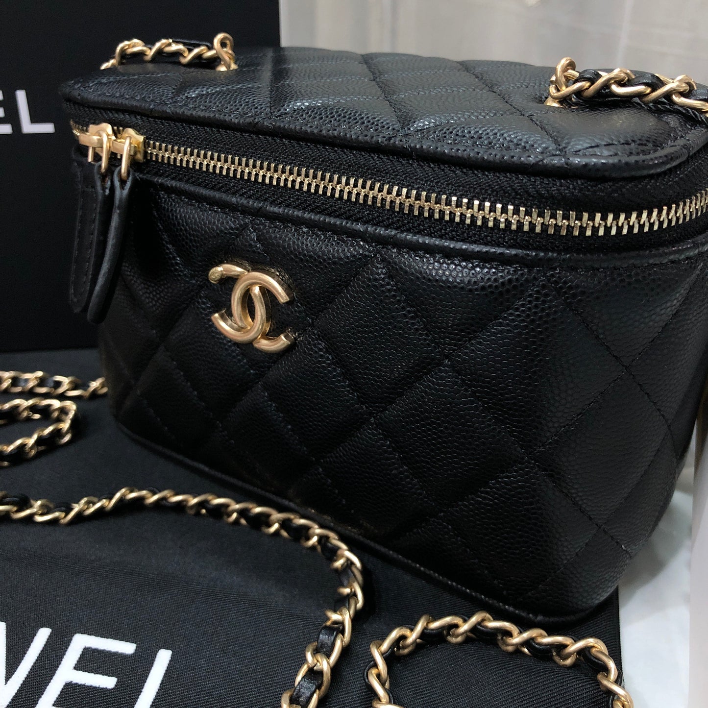 Chanel black caviar quilted vanity case