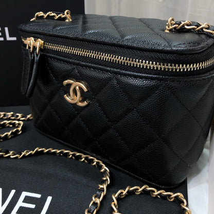 Chanel black caviar quilted vanity case