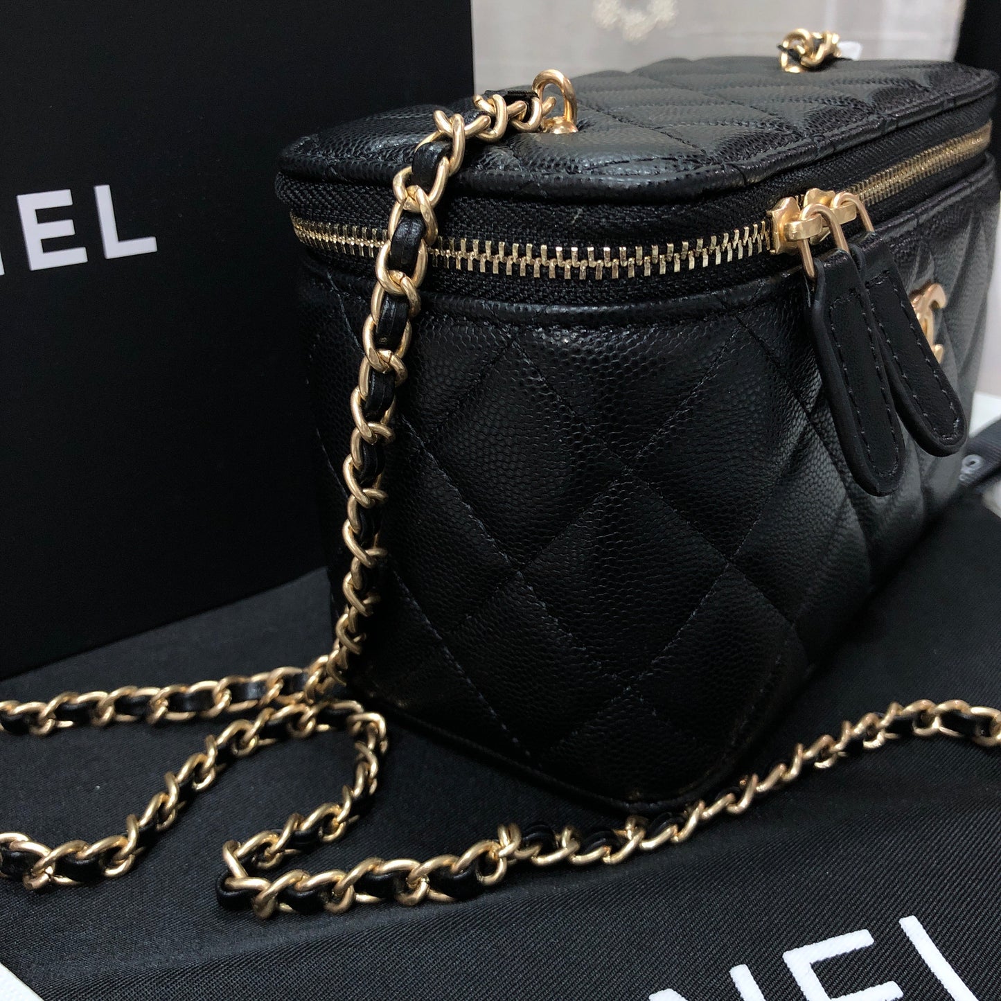 Chanel black caviar quilted vanity case