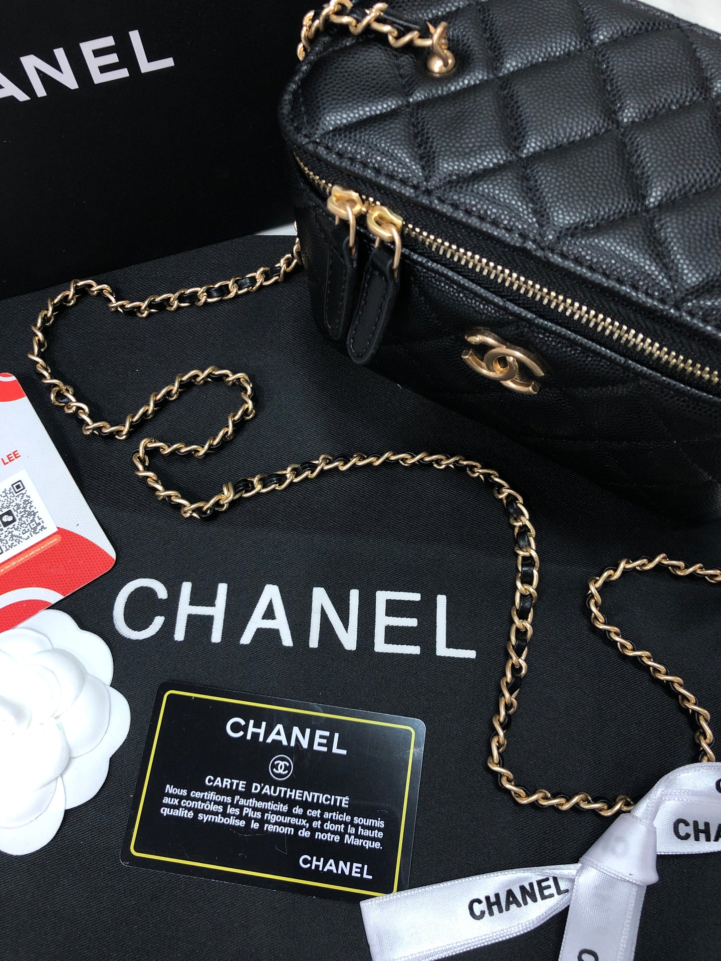 Chanel black caviar quilted vanity case