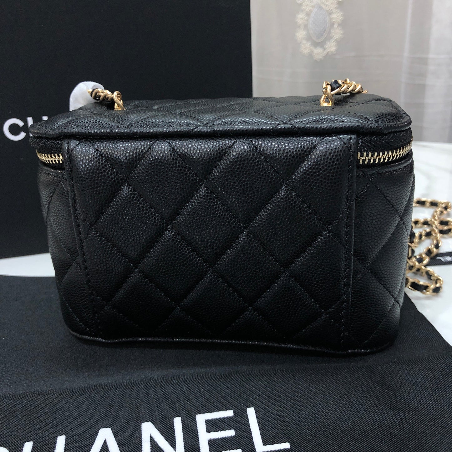 Chanel black caviar quilted vanity case