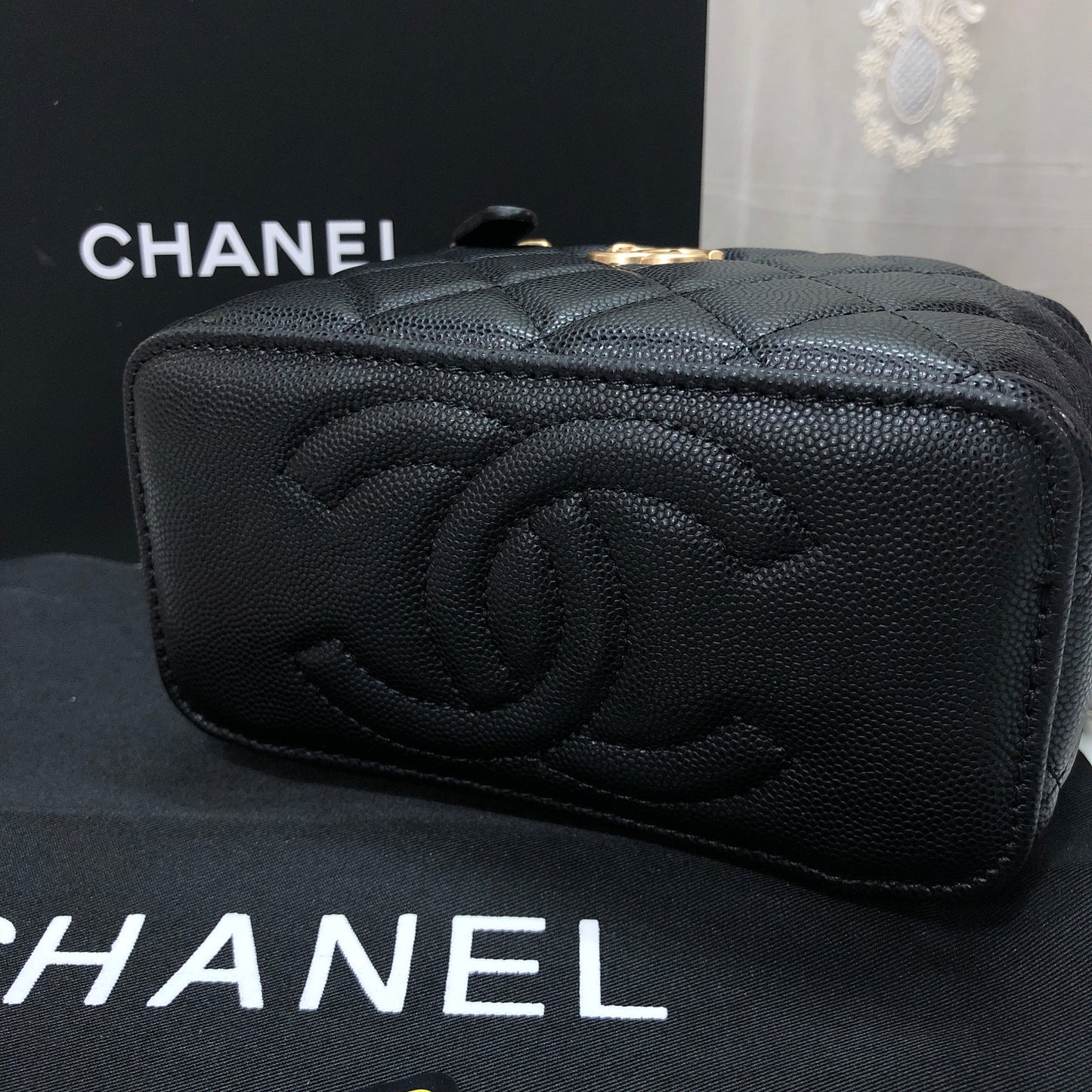 Chanel black caviar quilted vanity case