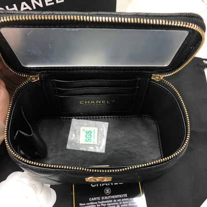 Chanel black caviar quilted vanity case