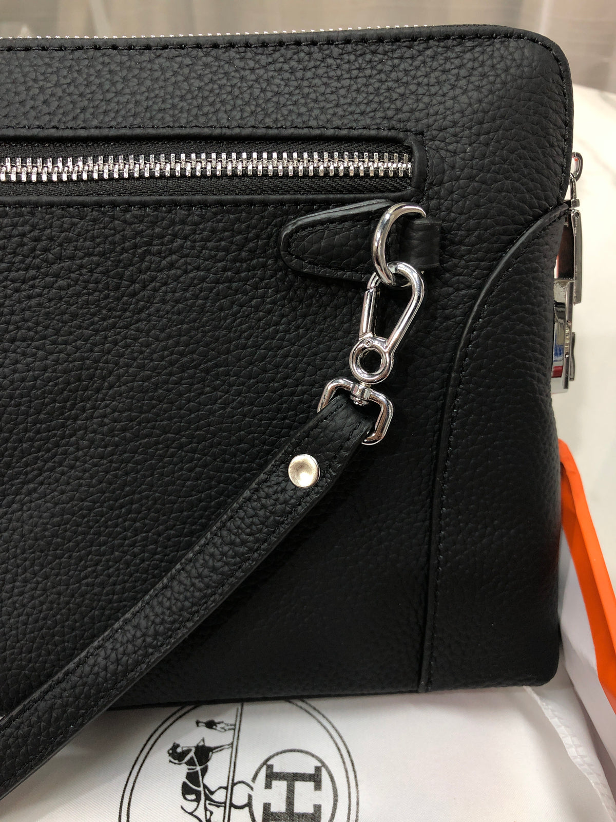 Black embossed horse and carriage leather zipper pouch