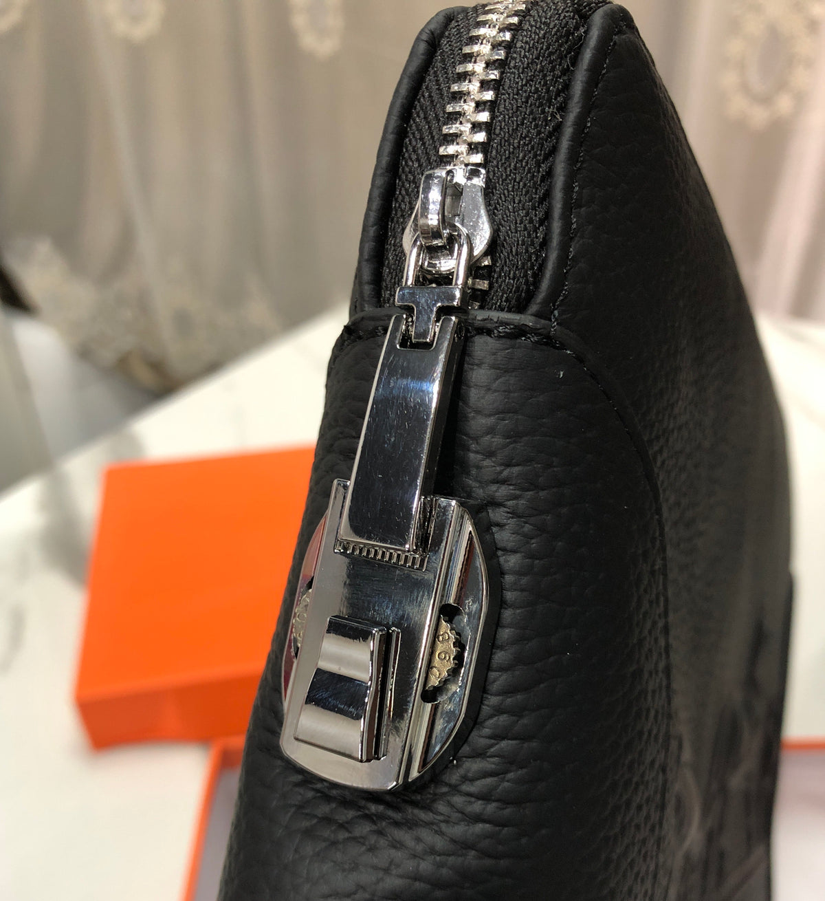Black embossed horse and carriage leather zipper pouch
