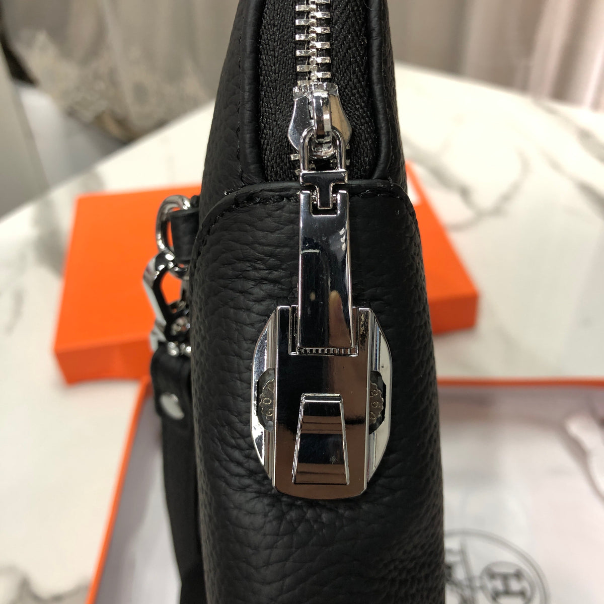 Black embossed horse and carriage leather zipper pouch